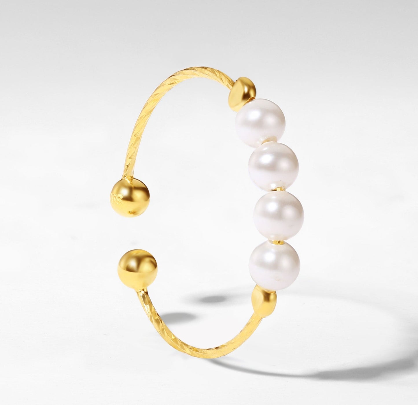 Pearl rotating ring